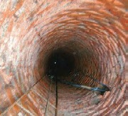 Nedkig i typisk murstensbrønd